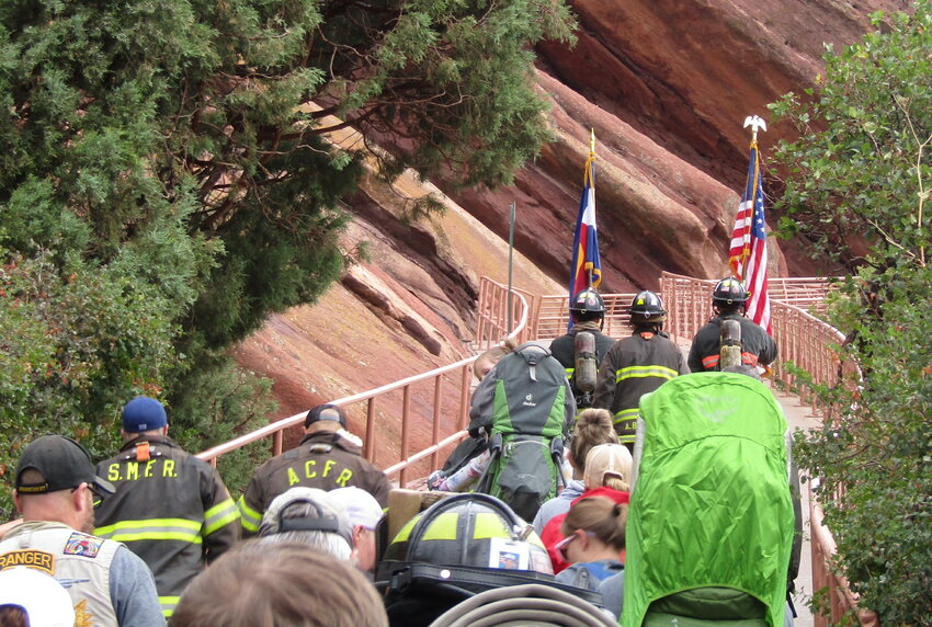 A color guard leads participants up the ramp into Red Rocks Amphitheater to begin the 9/11 Memorial Stair Climb.